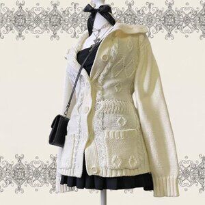 Cream knit cardigan with button details and pockets